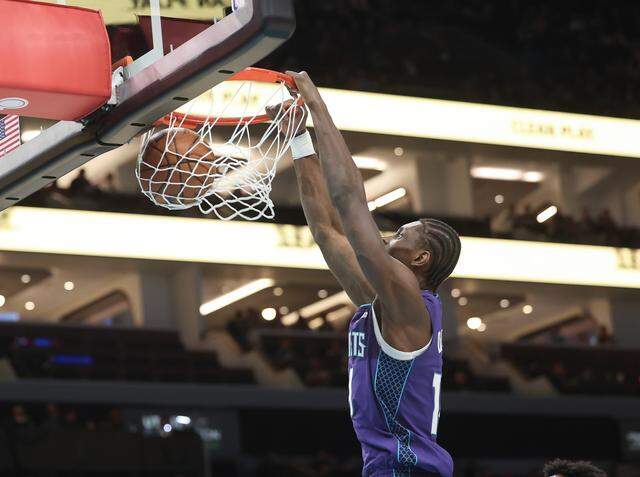 Charlotte Hornets forward Moussa Diabate dunks the ball during the first quarter of the game against the Miami Heat on Tuesday at Spectrum Center in Charlotte.